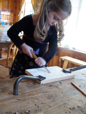 This is the correct way to handle a carving gouge or paring chisel--both hands behind the cutting edge at all times!